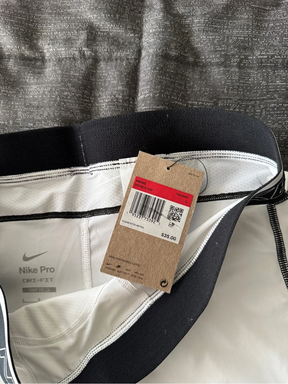 Nike White Compression Leggings with Black Waistband and Swoosh Detail